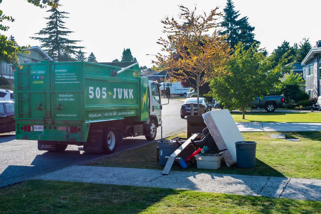505-Junk truck removing a pile of rubbish removal in Richmond