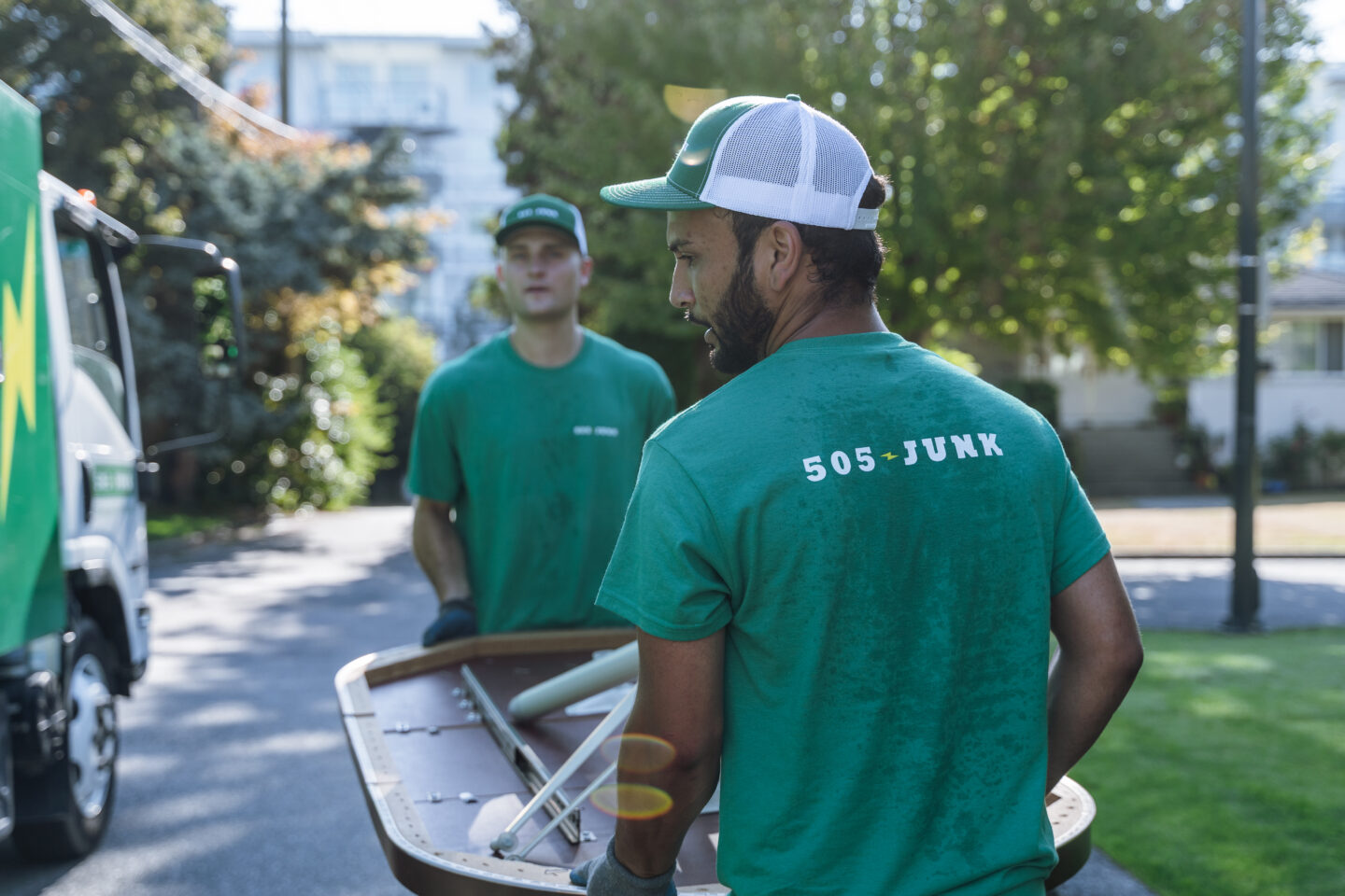 Our team members removing a table during a furniture removal in North Vancouver.