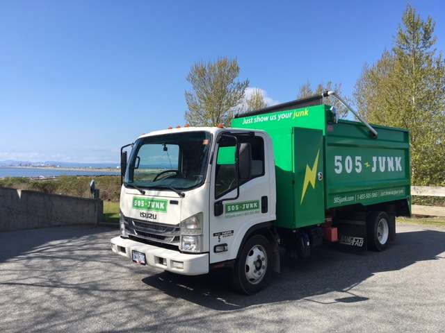 A 505-Junk truck at the beach collecting material for recycling.