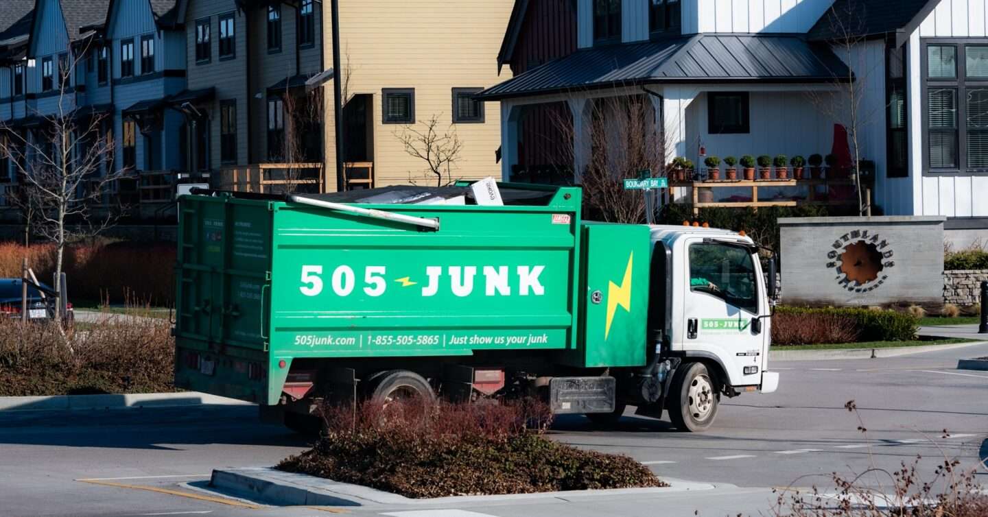 505-Junk truck pulling up to an appliance removal in Richmond