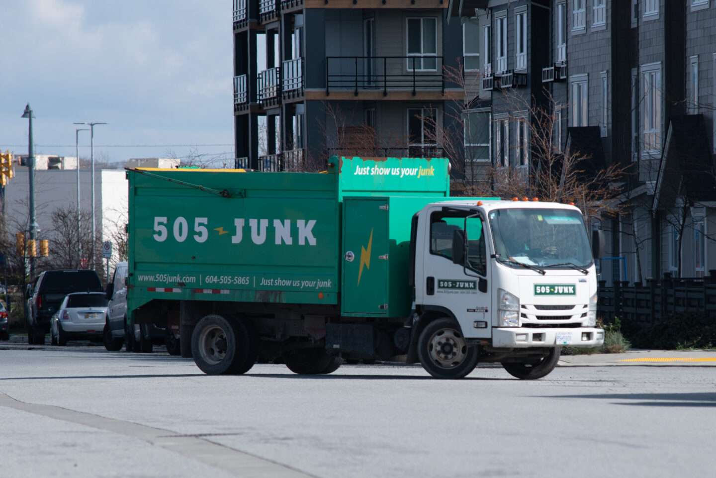 505-Junk truck driving down the road to a hoarding removal in Vancouver