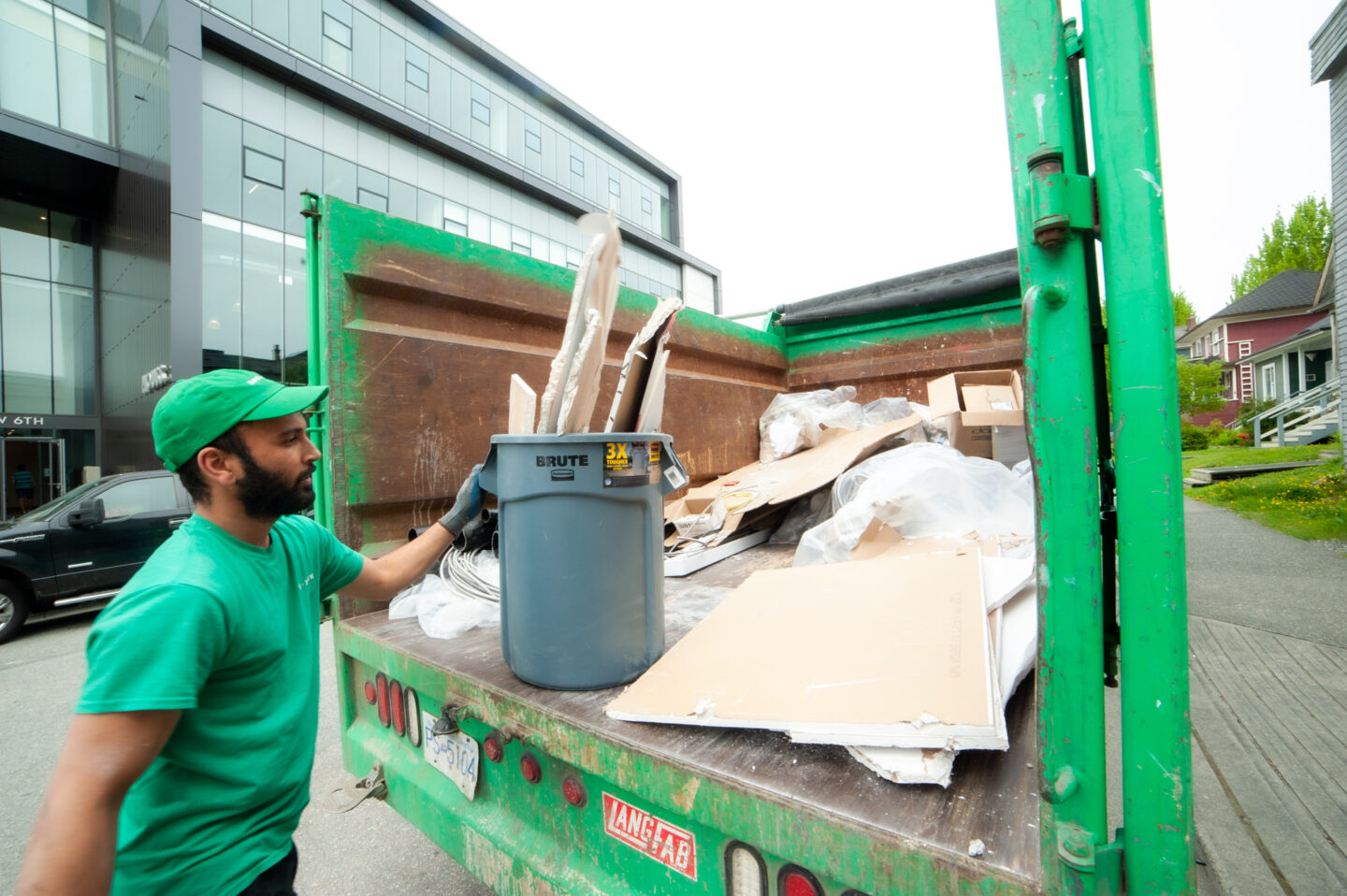A 505-Junk team member loading material into the back of our truck to be weighed during a construction removal in New Westminster.