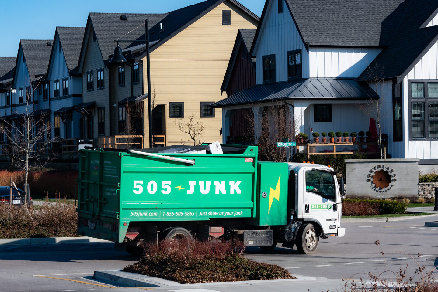 A 505-Junk heading to declutter a yard to create a beautiful outdoor space.